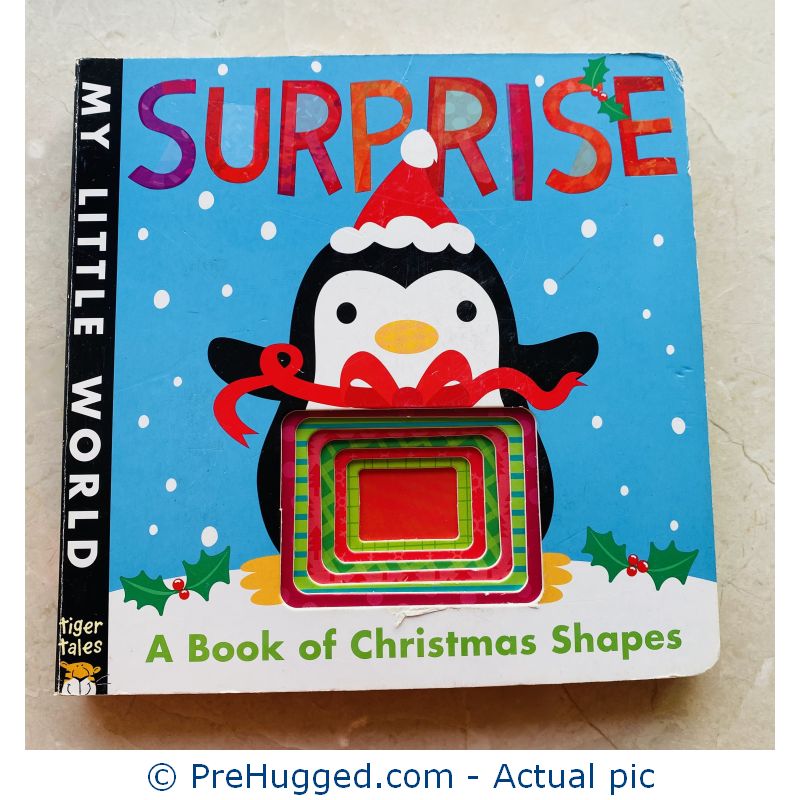 Surprise: A Book of Christmas Shapes Board book